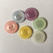 Mill-edge plastic buttons