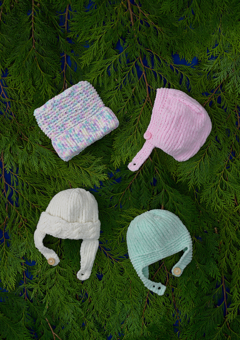 James C Brett JB709 Baby Hats in Flutterby Chunky